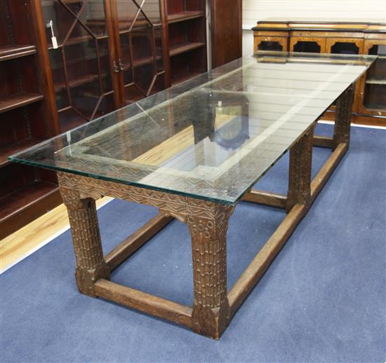 An 18th century and later Continental carved oak refectory table, oak plank top L.9ft 2in. W.3ft